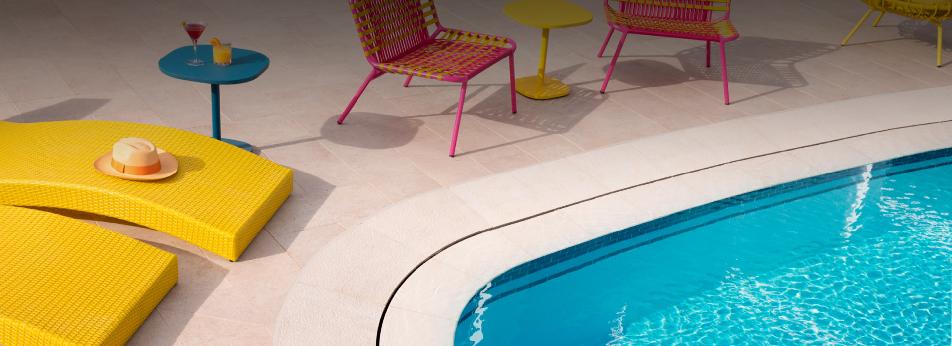 lake nona wave hotel pool with yellow and pink chairs