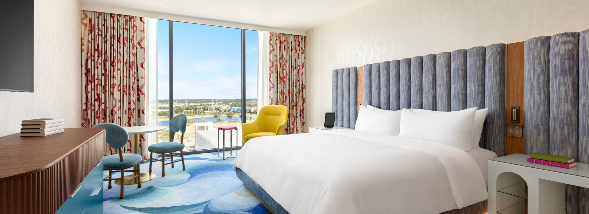 lake nona wave hotel model king room with a bed and a view