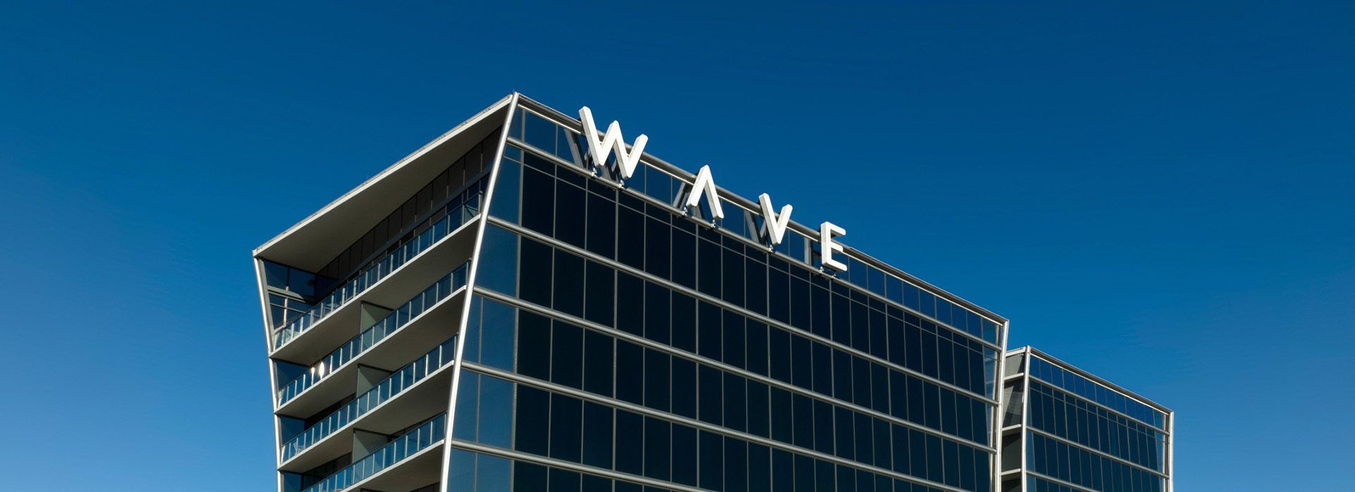 exterior of wave hotel sign