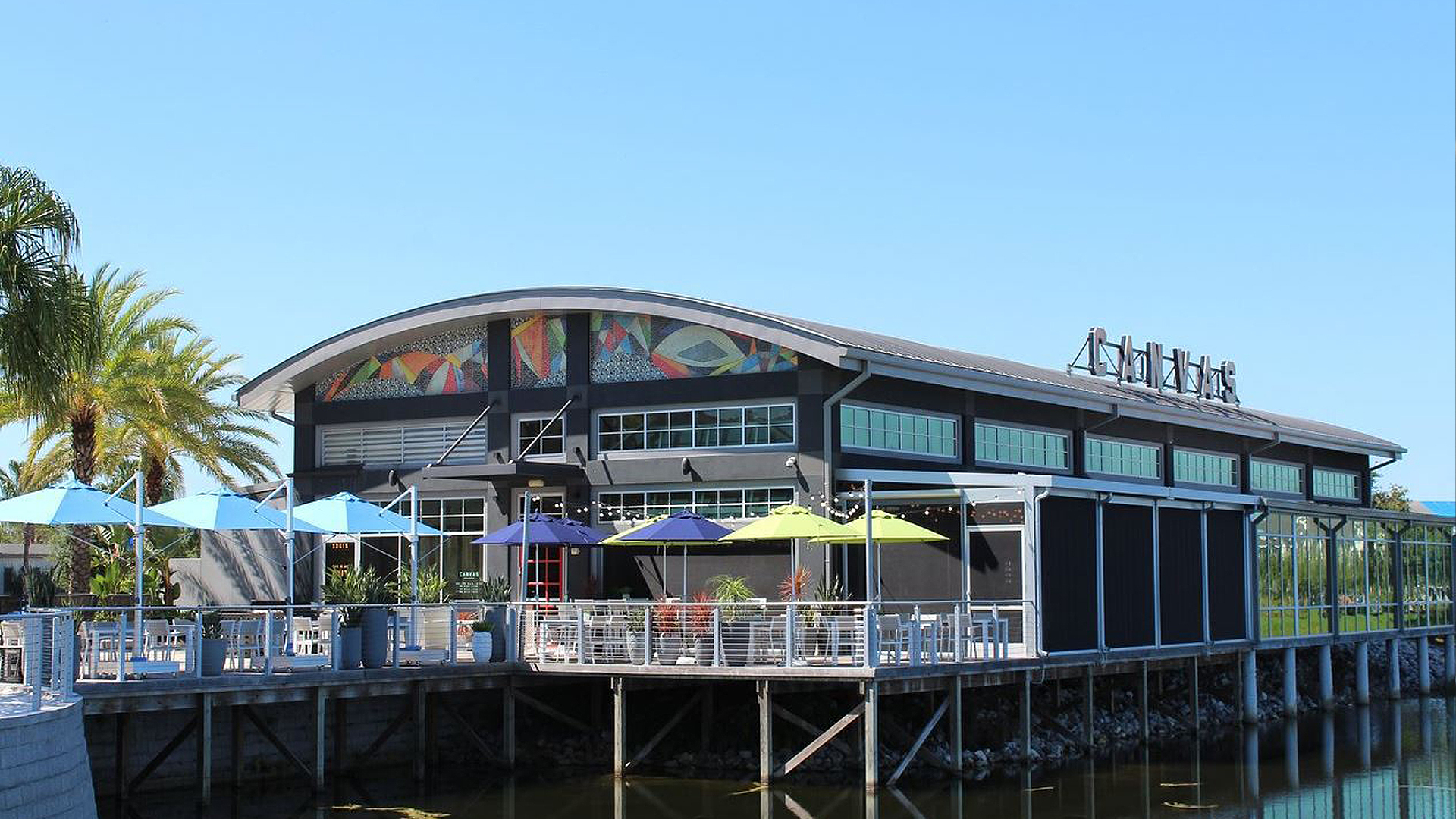 exterior of restaurant building overlooking water