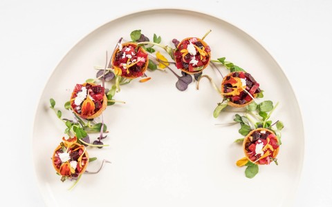round food bites with microgreens on a plate