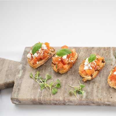 bruschetta bites on a board
