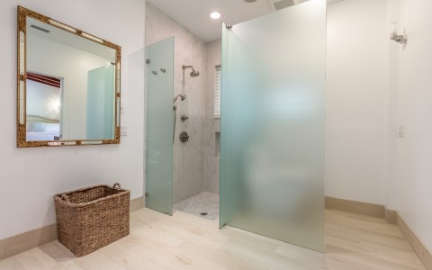 hotel bathroom with glass walk in shower