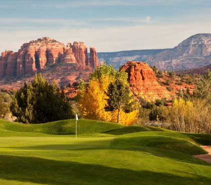View of a large golf course and the Red Rock Country on the background