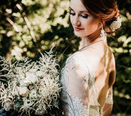 View of a beautiful bride holding a bouquet 
