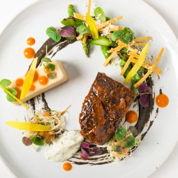 elegant, colorful dish with steak