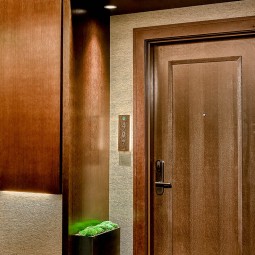 dark wooden door to a guest room