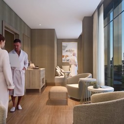 guy and lady at the spa next to a large window with the view of the city