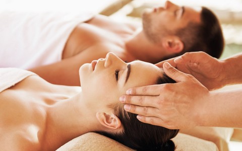 view of a man and a woman getting a couples massage