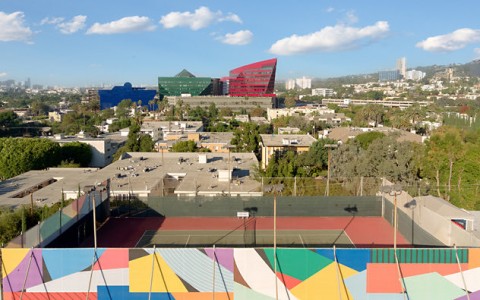 aerial view of hotel tennis court and hollywood buildings 