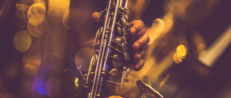 Close up of hand playing sax