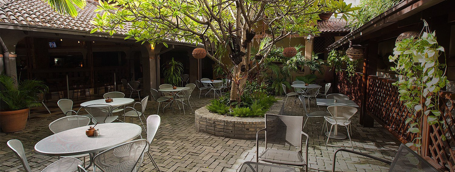 Brick paved courtyard with glass tables
