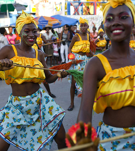 Women dressed in vibrant dresses during carnival