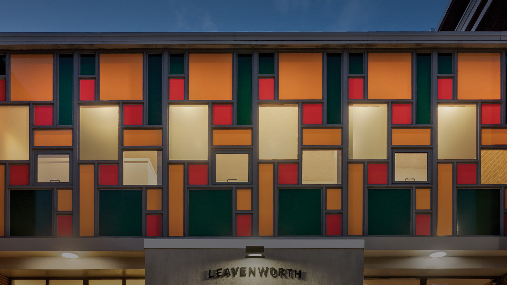 view of the colorful windows above the leavenworth sign 