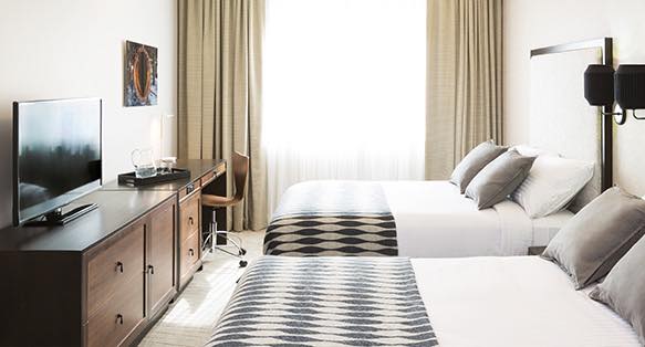 Guest room bed with diamond duvet