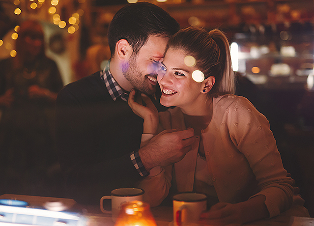 A man kissing his girlfriend
