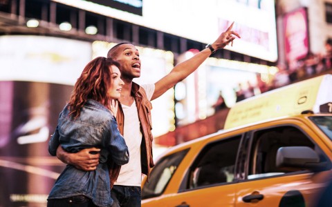 couple calling for a yellow cab