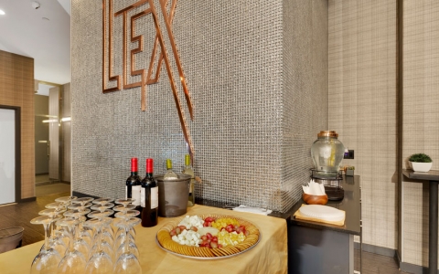 cheese and cracker platter with wine and wine glasses