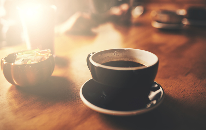 close up of coffee cup with lens flare