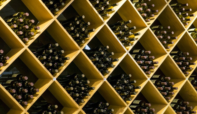 Diamond shaped wine shelves with multiple bottles in each shelf