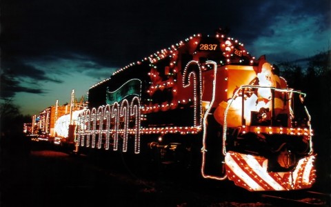 train decorated in Christmas lights