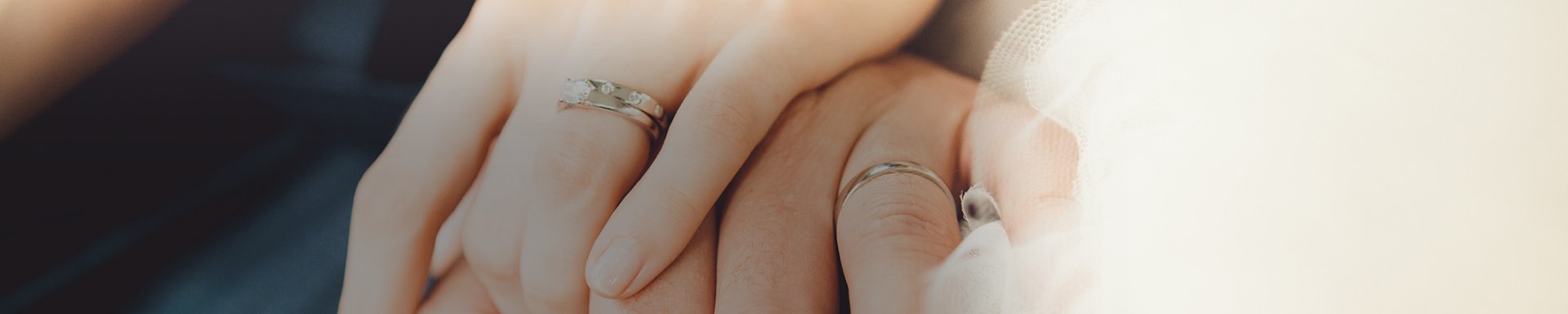 zoomed view of couple with wedding bands