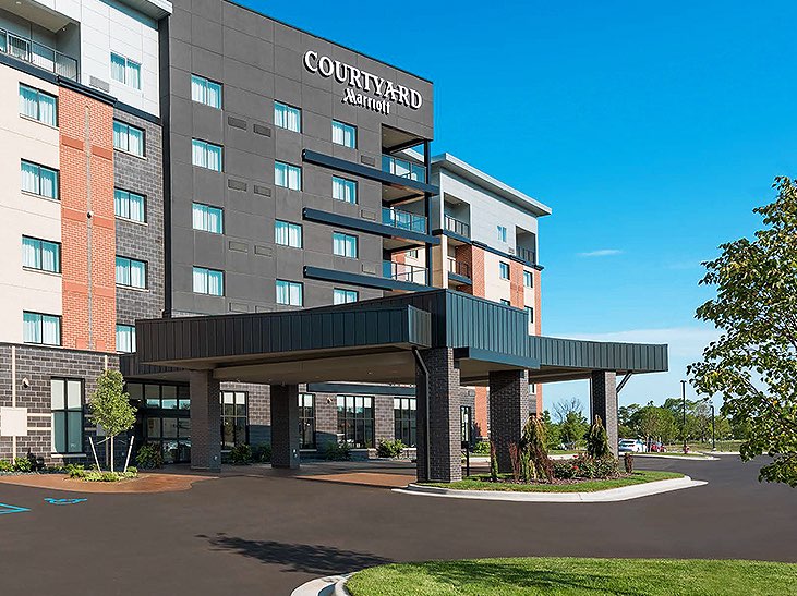 Courtyard Marriott grey building with brick accents