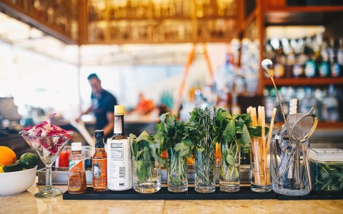 Bar topped with garnishes for mojito's