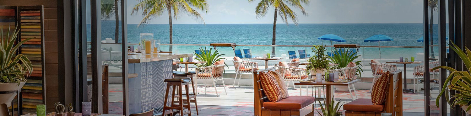 Outdoor dining with view of ocean