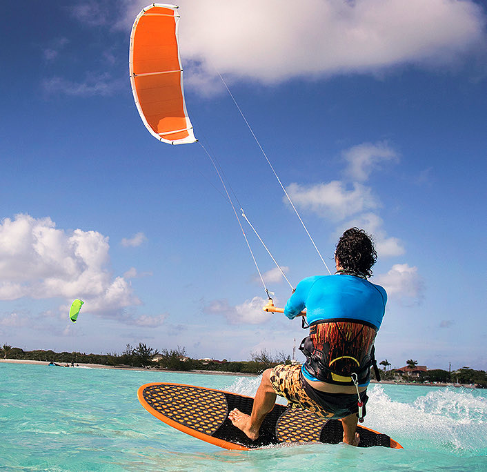 A man doing kitesurfing at the sea