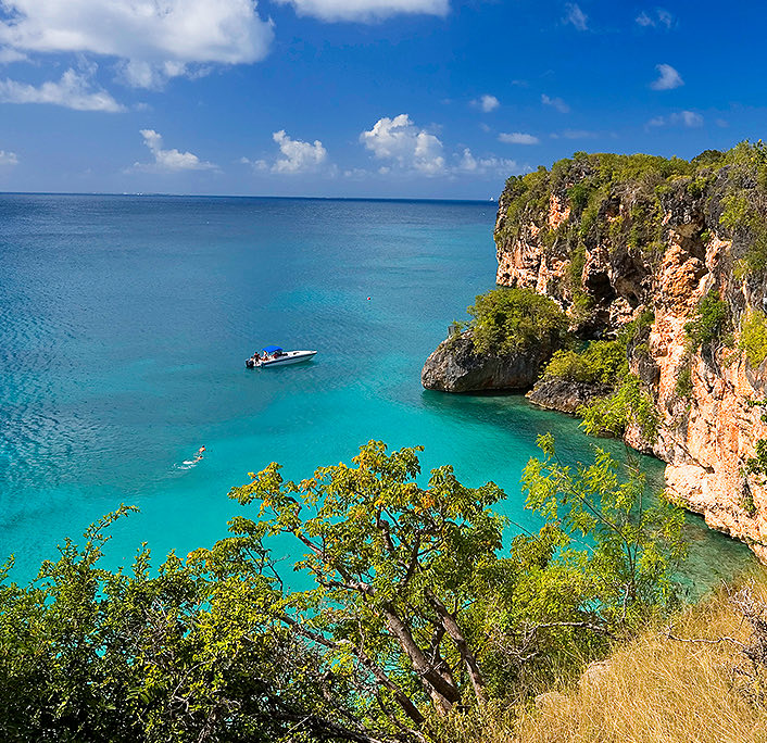 View of a boat at the little bay sea