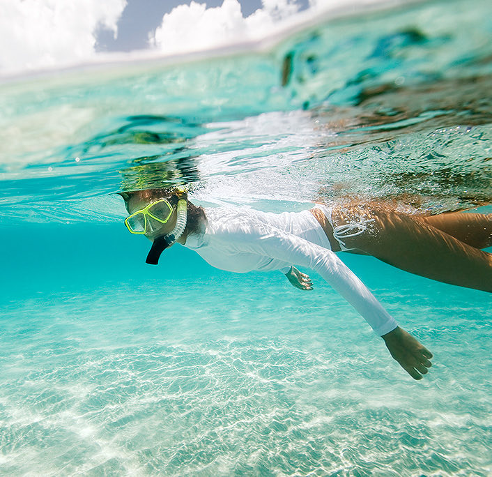 A woman snorkeling at the sea