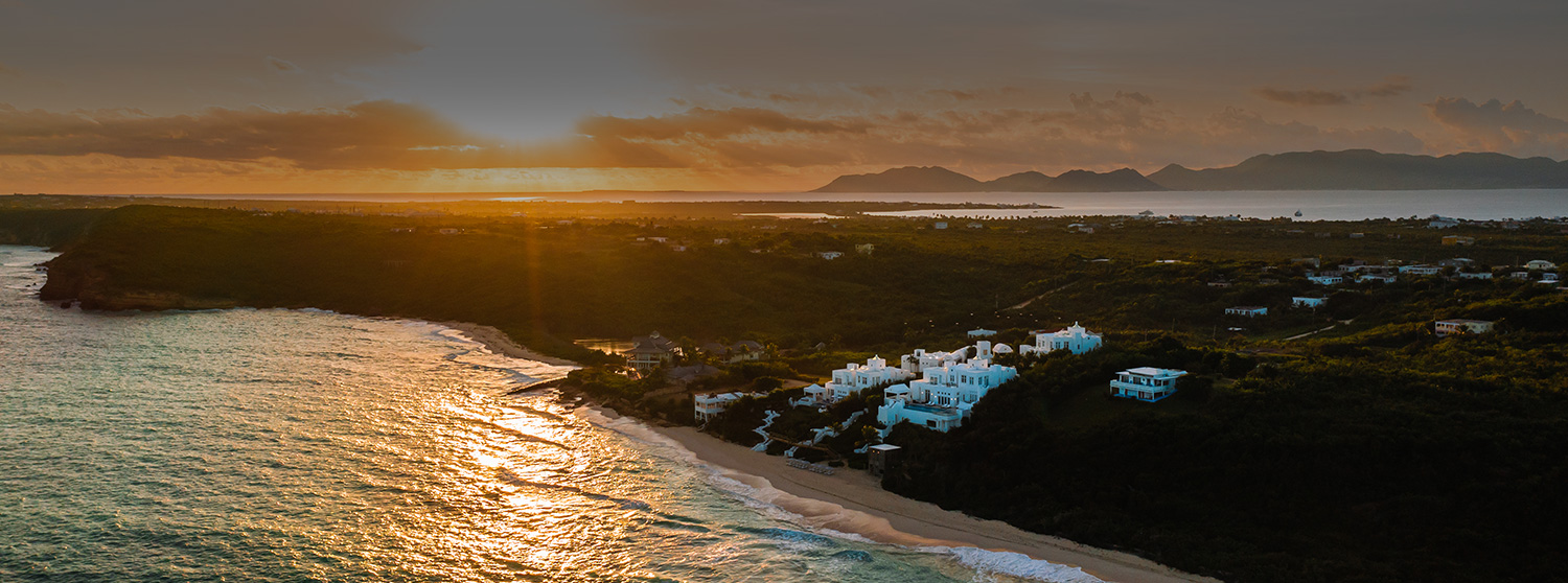 aerial view of long bay at sunset