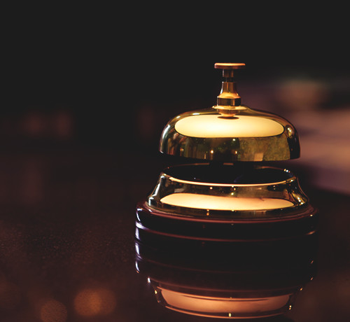 Gold bell on wooden desk