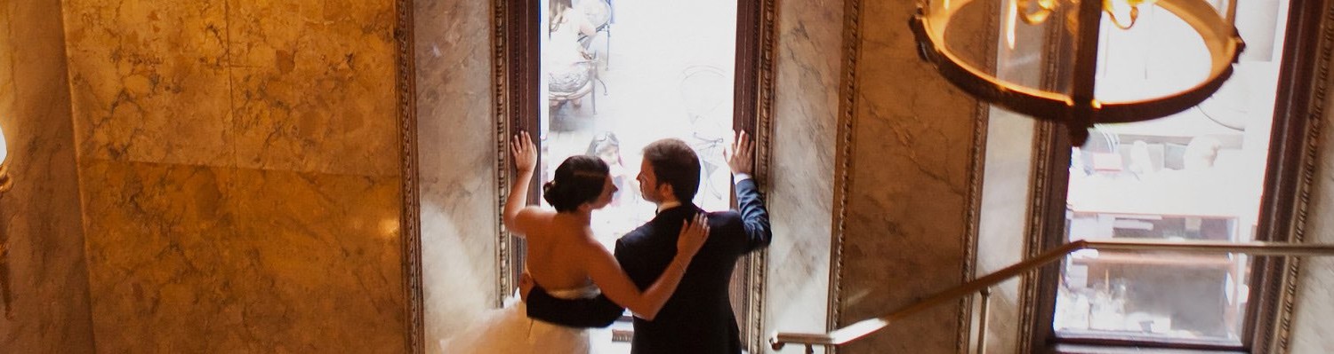 bride and groom looking out the window