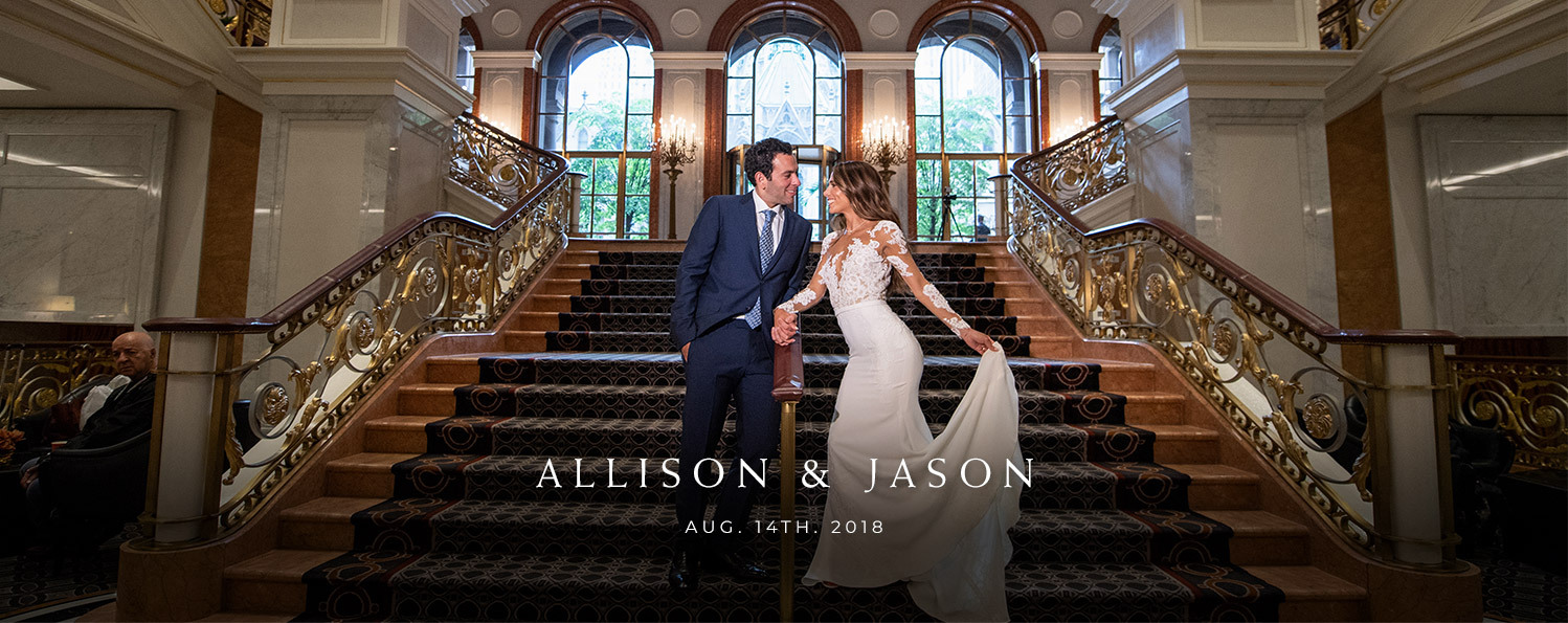 couple taking photos in the staircase