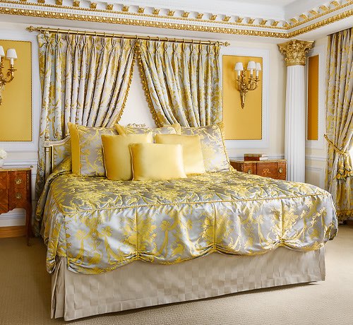 king bed with gold and silver comforter