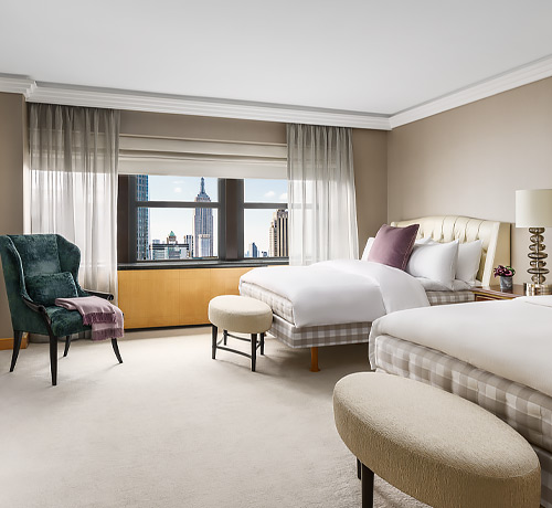 double bedroom with view and a chaise