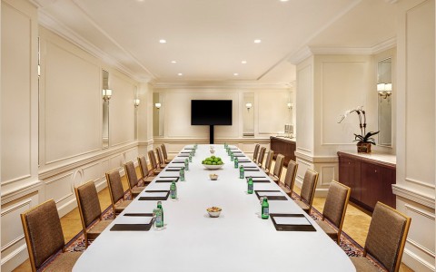 long table with chairs set for a board meeting