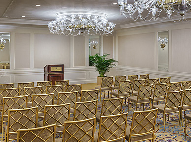 hubbard venue with gold chairs and a chandelier 