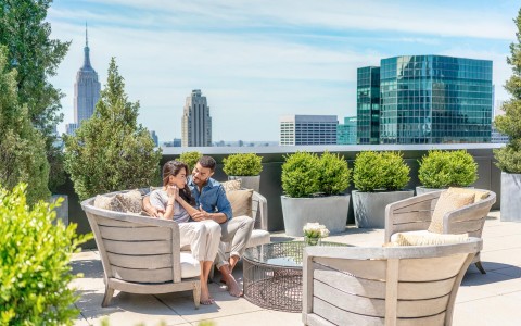 couple on the roof in lounge chairs