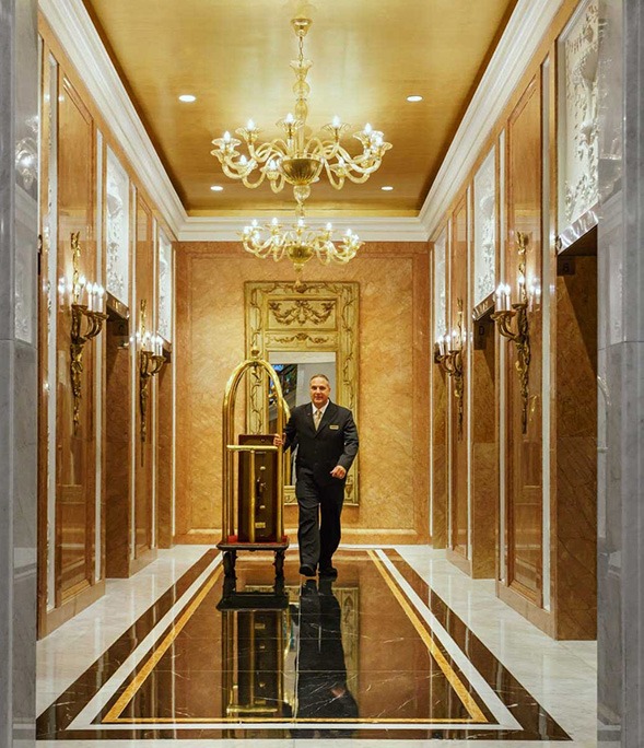 Bellhop with luggage cart