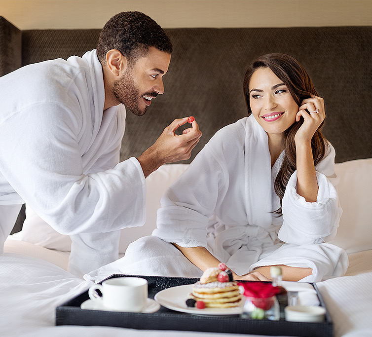 couple having breakfast in bed
