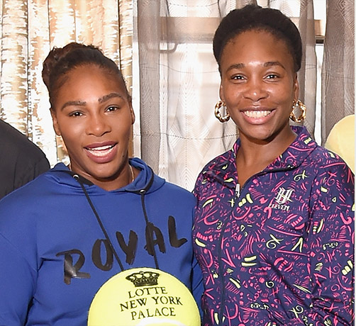 serena williams and venus williams smiling for a photo