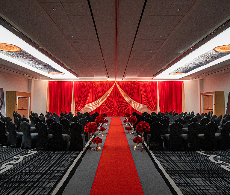 ballroom wedding venue with red drapes