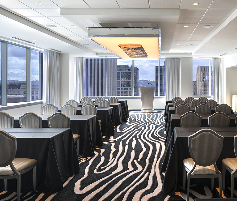 A smaller-size meeting space with a background of the city