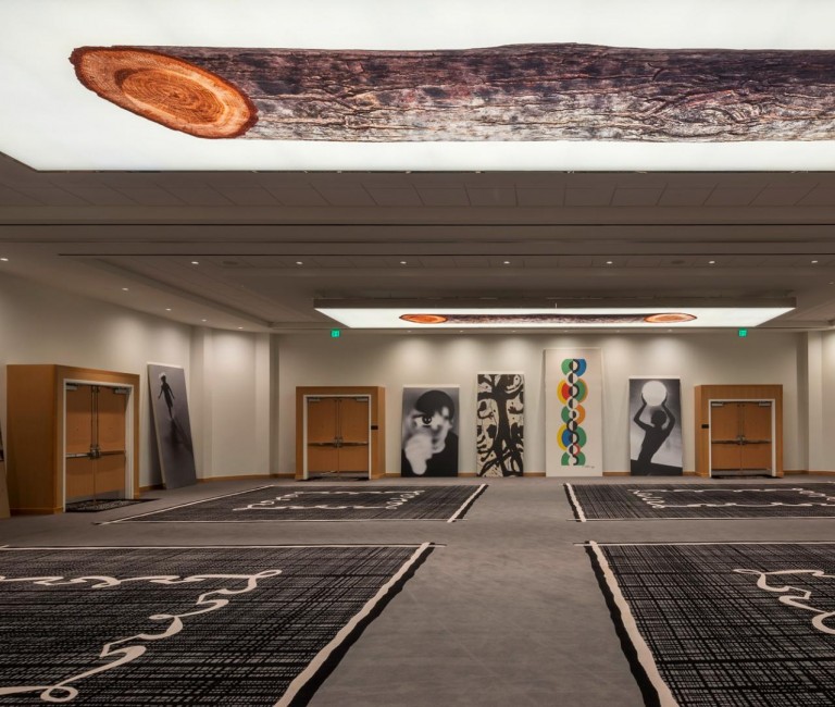 a larger size ballroom venue space filled with art pieces