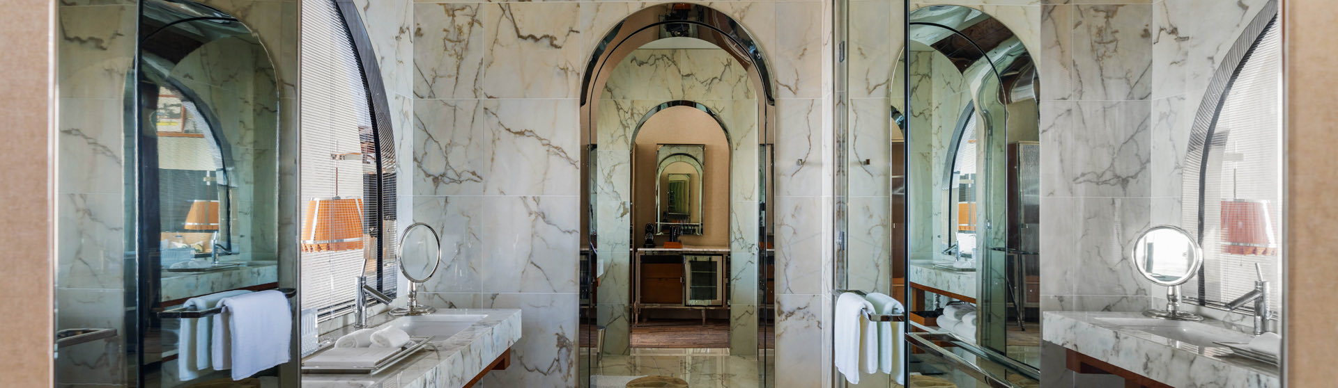 marbled bathroom with archways