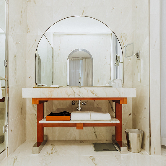 bathroom vanity with rounded mirror