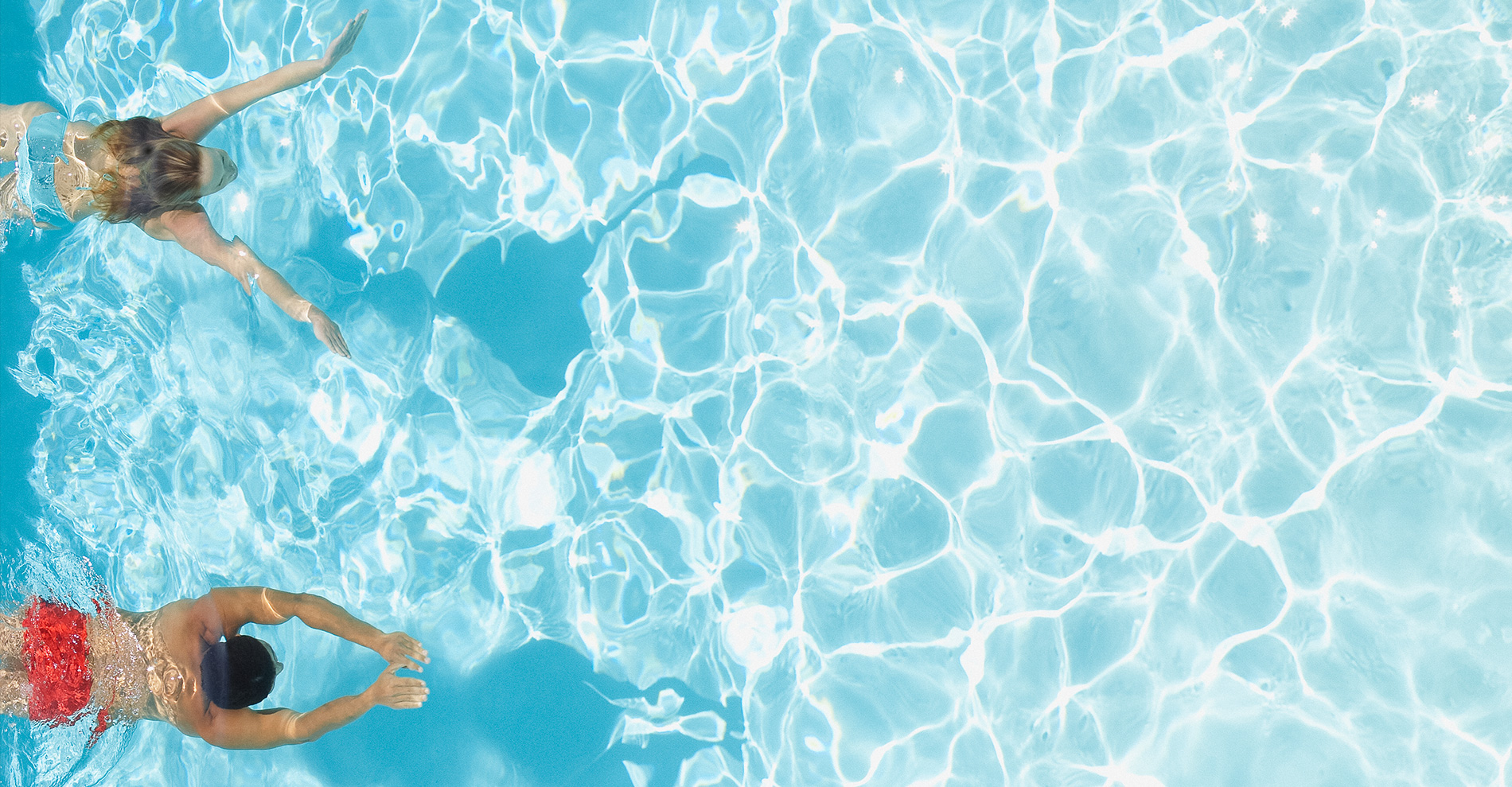 couple swimming in pool